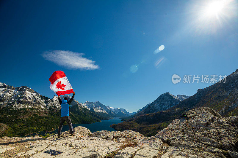 Waterton Lakes National Park and man with Canada flag